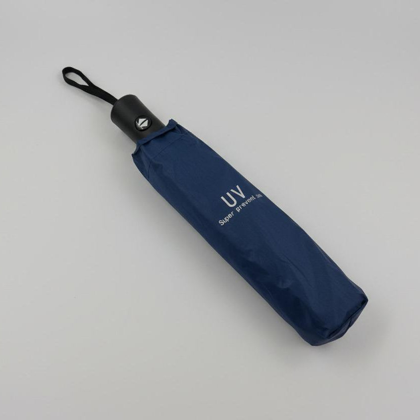 Folded navy blue umbrella with 'UV' text on a grey background