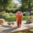 Red football cup with straw and floating bead dome lid