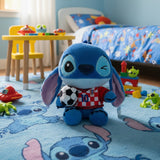 Blue plush in a checked number 10 jersey holding a black and white soccer ball
