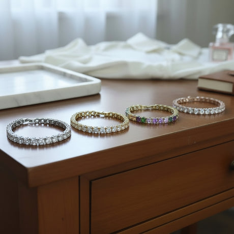 Four bracelets on a wooden surface with a blurred background