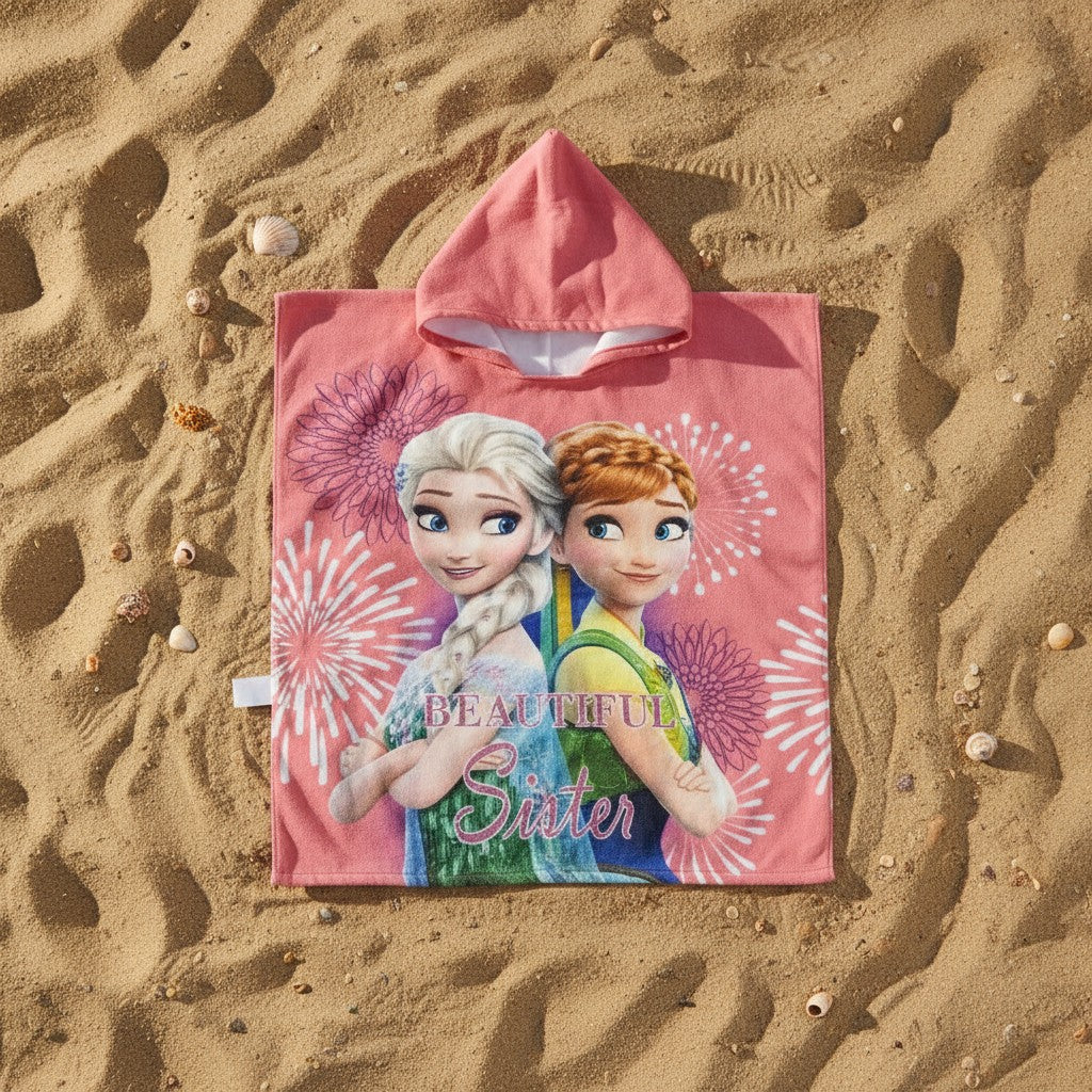 Coral pink Frozen sisters hooded towel poncho worn at sunset