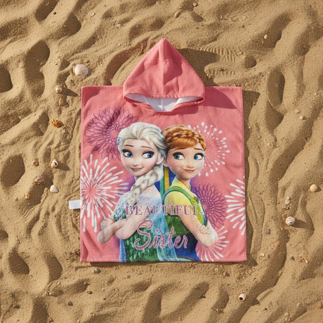 Coral pink Frozen sisters hooded towel poncho worn at sunset