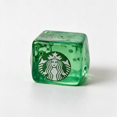 Green jelly ice cube squishy with small lime slices inside