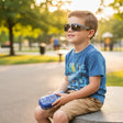Boy wearing silver sport sunglasses with a blue gaming print case, Jack Gifts Online Lebanon