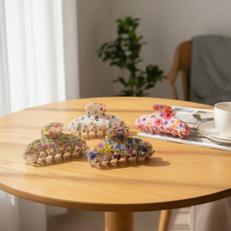 Garden print claw clips in five floral colours on a wooden table, Jack Gifts Online Lebanon