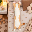 Ginger long cat body pillow plush on a teddy bear print bed with a 100 cm measuring line