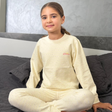 Cream pointelle pyjama set for girls with a pink script chest print