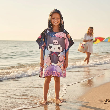 Girl wearing a hooded beach poncho towel with space print at the shore, Jack Gifts Online Lebanon