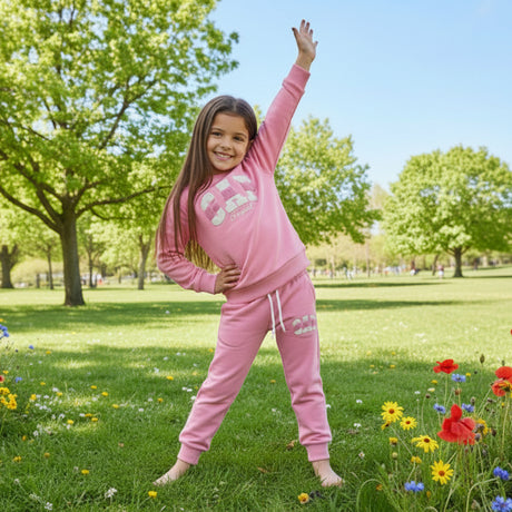 Girls pink tracksuit set, crew neck sweatshirt with drawstring cuffed joggers, outdoor shot