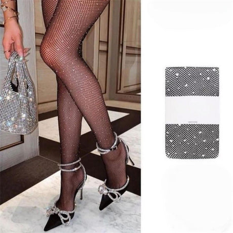 Black fishnet tights adorned with sparkling rhinestones, displayed on a model wearing high heels