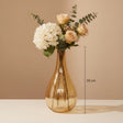 The squattest amber teardrop with hydrangea and peach roses, marked 30 cm