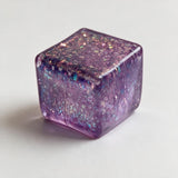Purple glitter jelly cube squishy packed with holographic sparkles