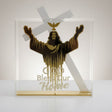 Gold figure of Christ with arms raised beneath a dove, lettered God Bless Our Home