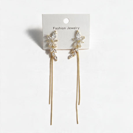 Pair of marquise crystal leaf earrings with long gold chain drops on a display card