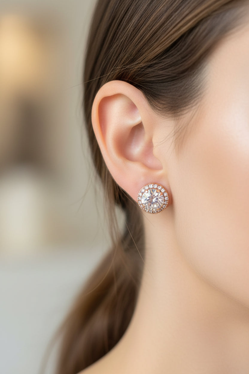 Close-up of a person wearing a sparkling earring with a blurred background