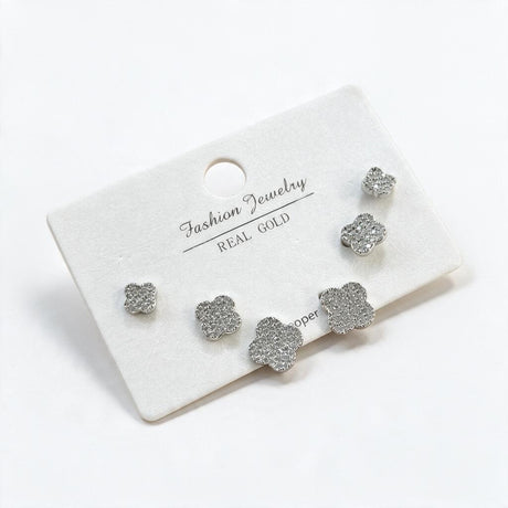 Silver pave crystal clover studs in three graduated sizes on a white display card