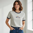 Woman wearing a gray tshirt with cartoon graphics