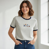 Woman wearing a gray tshirt with cartoon graphics