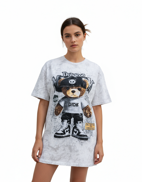 Woman wearing a gray tshirt with a teddy bear graphic and text on a white background