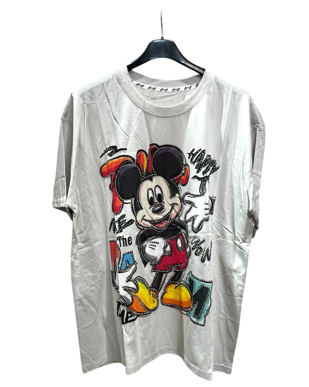 A white oversized tshirt with a colorful graphic of Mickey Mouse on the front