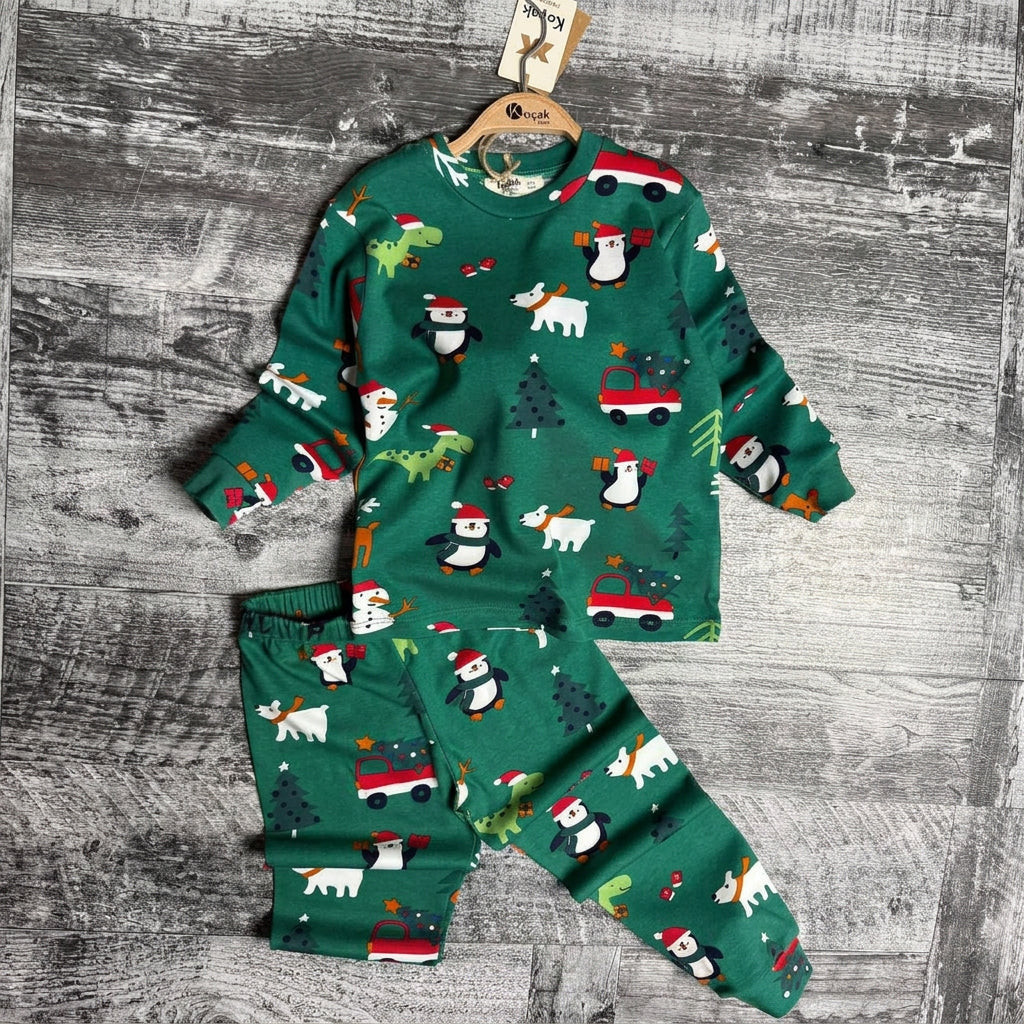 Green penguin and polar bear print pajama top and pants laid flat
