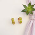 Green clover enamel hoop earring with white flowers