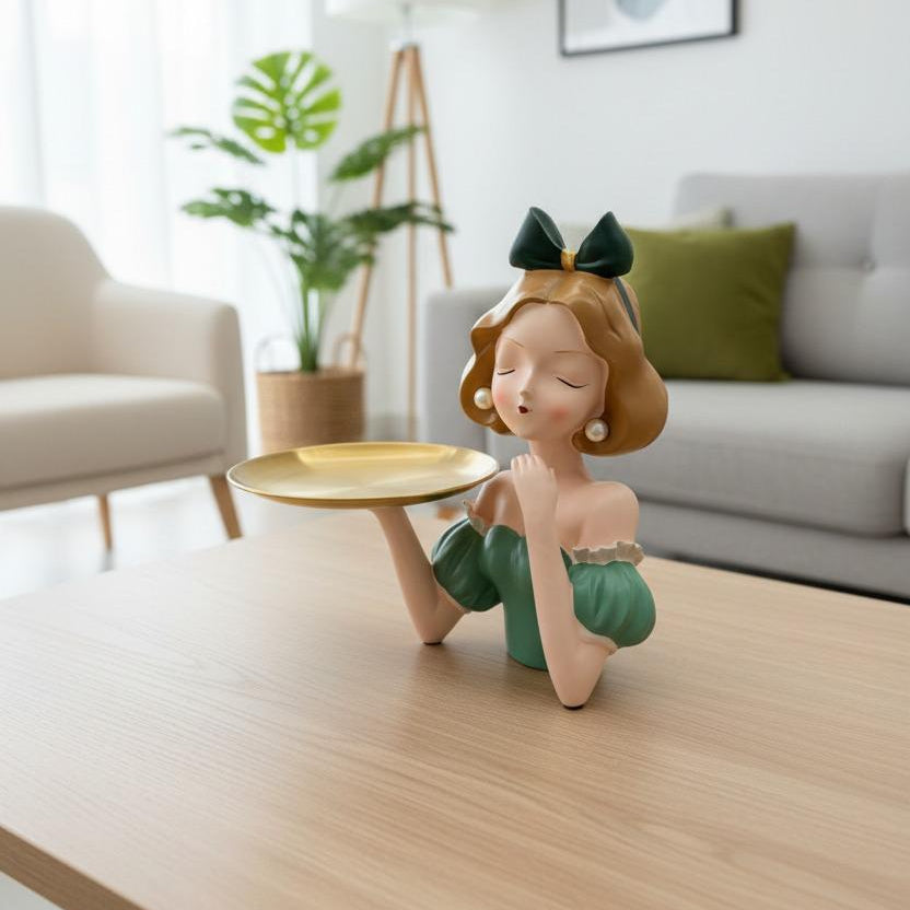 The green lady tray on an oak coffee table beside a monstera and a tripod lamp