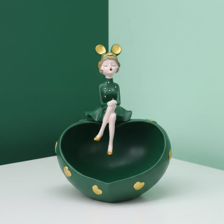 The green heart bowl on a forest and mint studio corner, gold heart studs catching light