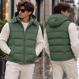 Front and back views of the green puffer worn as a sleeveless hooded vest over a cream top