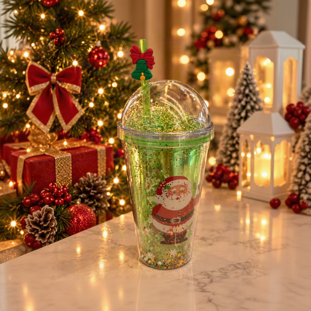 Green glitter dome lid straw cup with a Santa print and a bell straw topper with a red bow