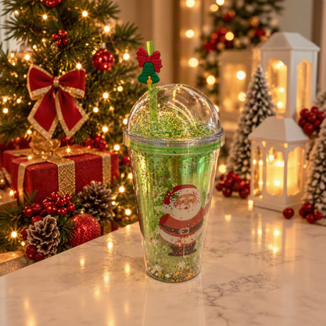 Green glitter dome lid straw cup with a Santa print and a bell straw topper with a red bow