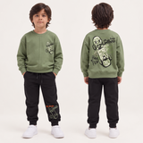 Boy in a green skateboard sweatshirt and black joggers, front and back view