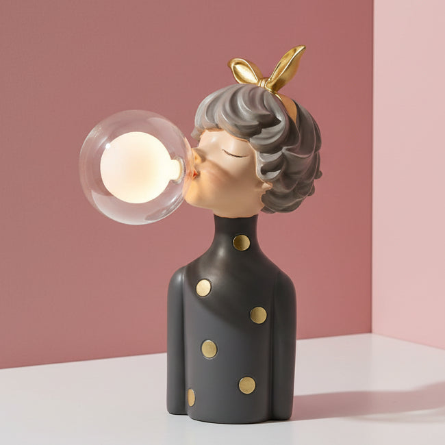 Gold bow on grey hair and gold spotted dress, a bulb burning inside the clear globe