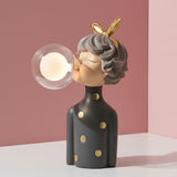 Gold bow on grey hair and gold spotted dress, a bulb burning inside the clear globe