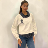 Marled grey sweatshirt with a navy check collar, worn with mid blue jeans