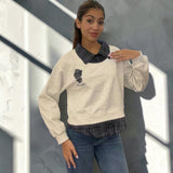 Grey marl sweatshirt in side light showing the balloon sleeve and ribbed cuff