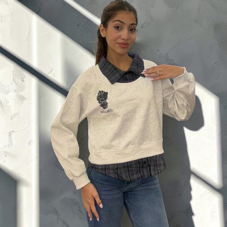 Grey marl sweatshirt in side light showing the balloon sleeve and ribbed cuff