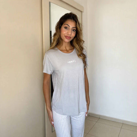 Close view of the script lettering on a heather grey pyjama top