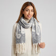Grey and cream floral print scarf wrapped once with long twisted cream tassel fringe