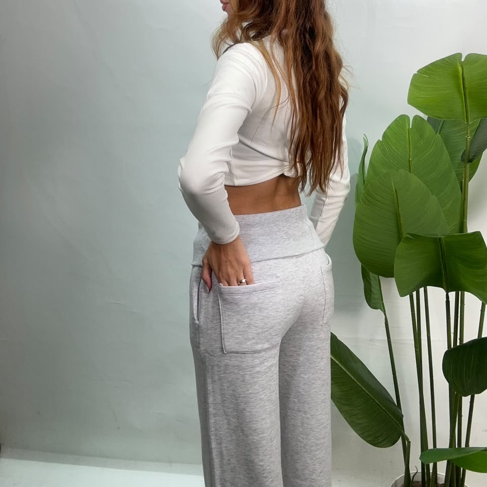 Back view of grey wide leg sweatpants with the fold over waistband