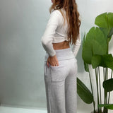 Back view of grey wide leg sweatpants with the fold over waistband