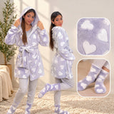 Grey hooded fleece robe with white hearts worn by two women, with fabric and sock close ups