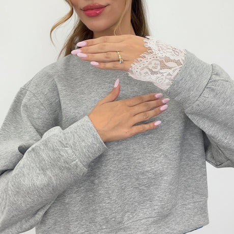 Lace panel detail on the sleeve of the grey marl sweatshirt