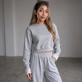 Grey set worn with both hands in the jogger pockets