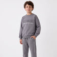 Boy in a grey Los Angeles sweatshirt and matching joggers, front view