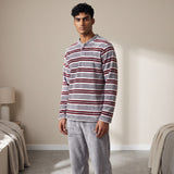 Grey fleece pyjama top with burgundy and white stripes, worn with plain grey bottoms