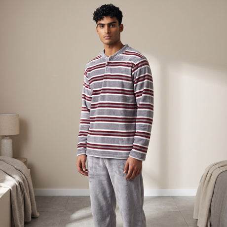 Grey fleece pyjama top with burgundy and white stripes, worn with plain grey bottoms