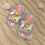 Grey unicorn slides with cloud print footbed shown on rippled sand