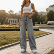 Woman in light grey wash high waist wide leg jeans and white top, Jack Gifts Online Lebanon