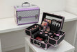 Grey studded aluminium vanity case with lilac trim beside an open case with a lid mirror
